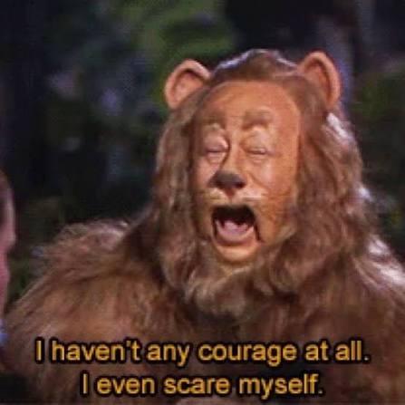 Cowardly Lion from The Wizard of Oz in a costume, saying, 'I haven't any courage at all. I even scare myself.'